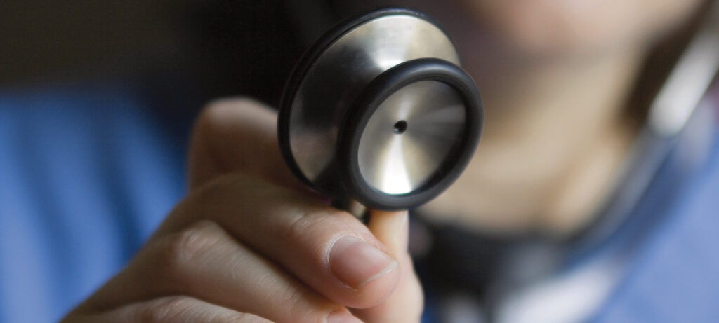 Doctor using stethoscope