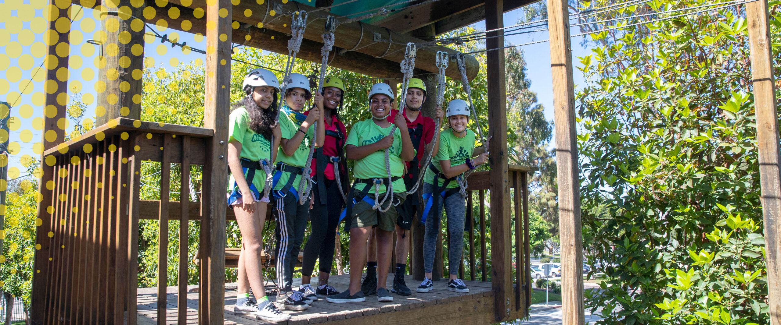 image of adventureplex staff and youth on the ropes course