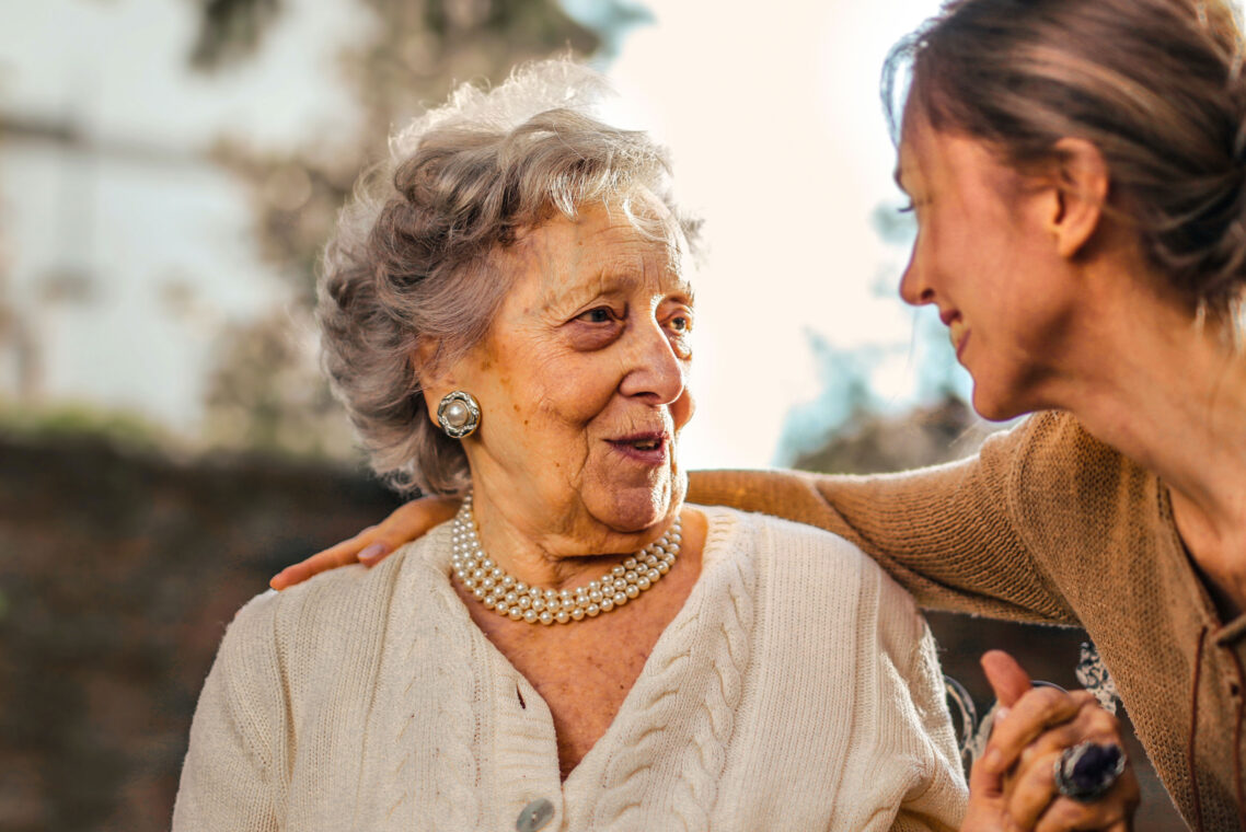 image of an elderly woman and young woman looking happy