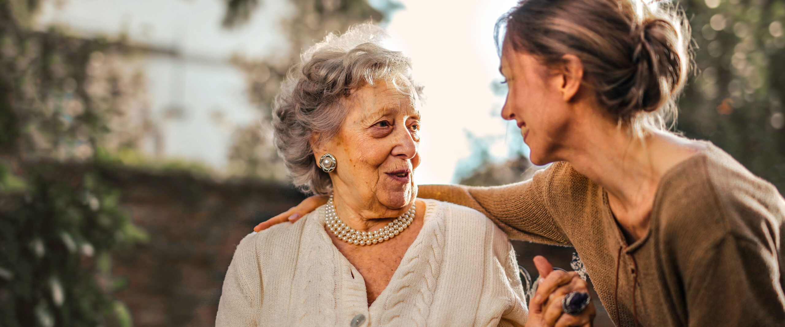 image of an elderly woman and young woman looking happy