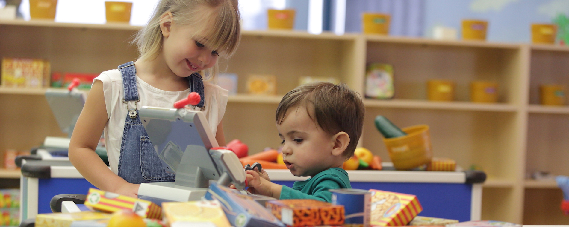 Boy and girl playing grocery store